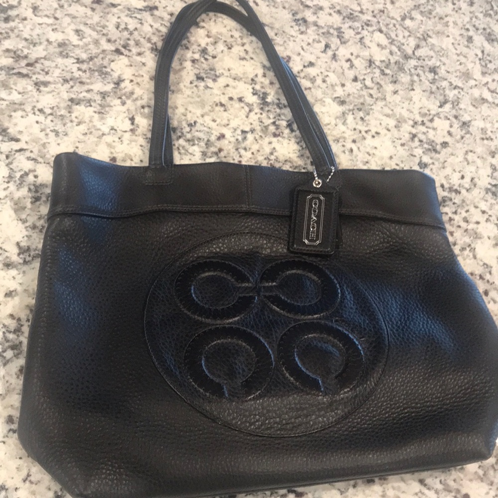 Chocolate brown Coach tote with 4 C logo